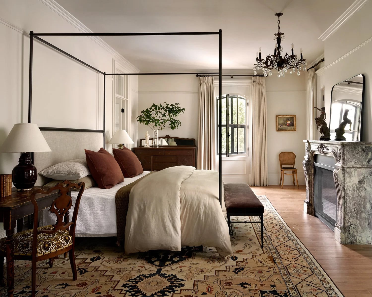Farmhouse bedroom in warm earth tones and vintage antiques