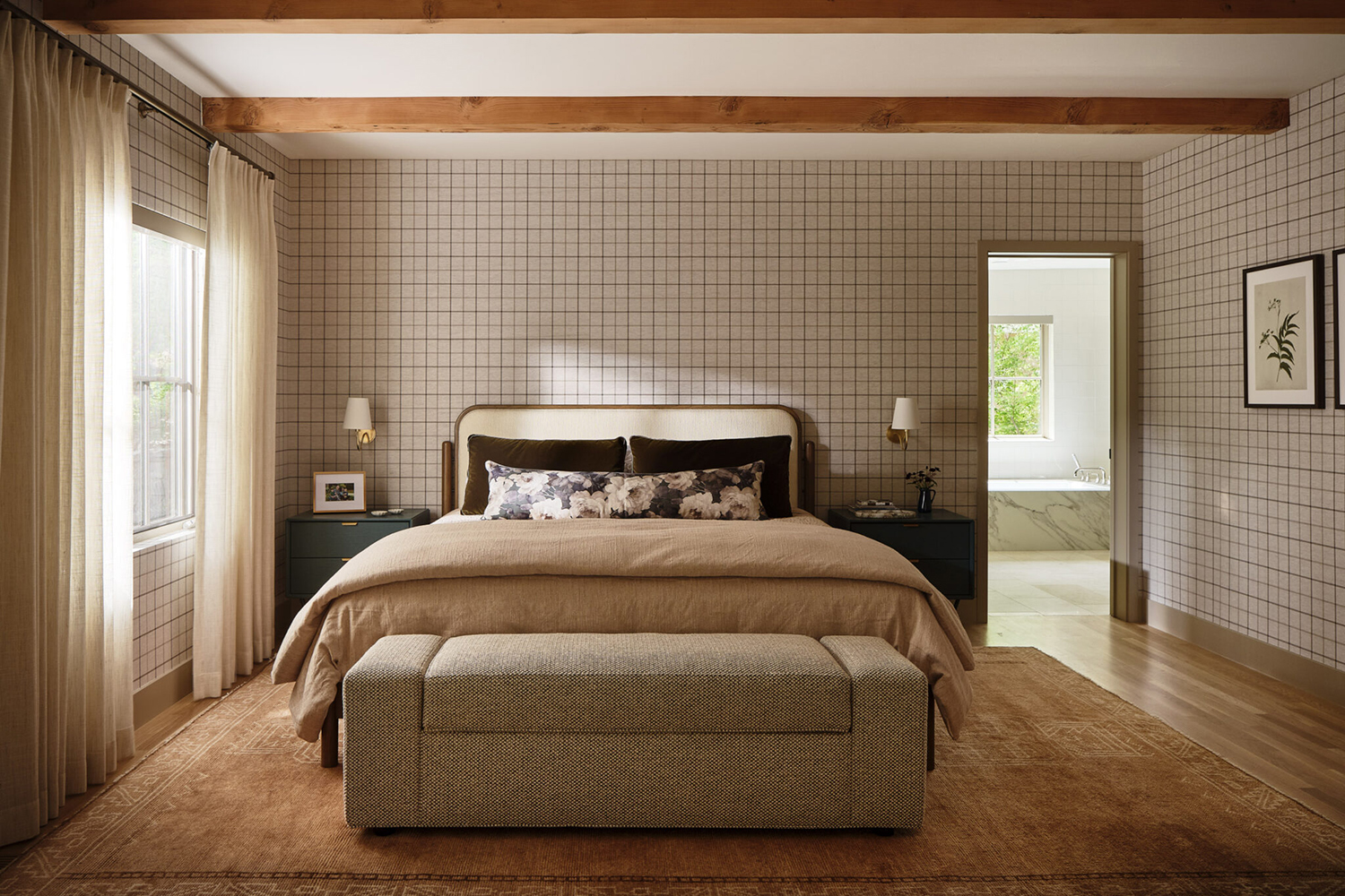 Farmhouse bedroom with windowpane wallpaper, wood ceiling beams, and warm earth tones throughout