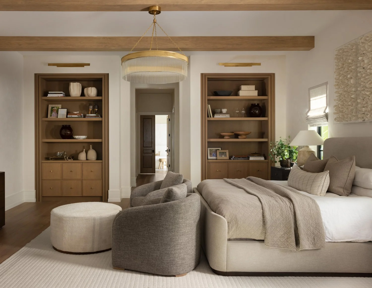 Farmhouse bedroom with wood built-in cabinetry and open shelving for display