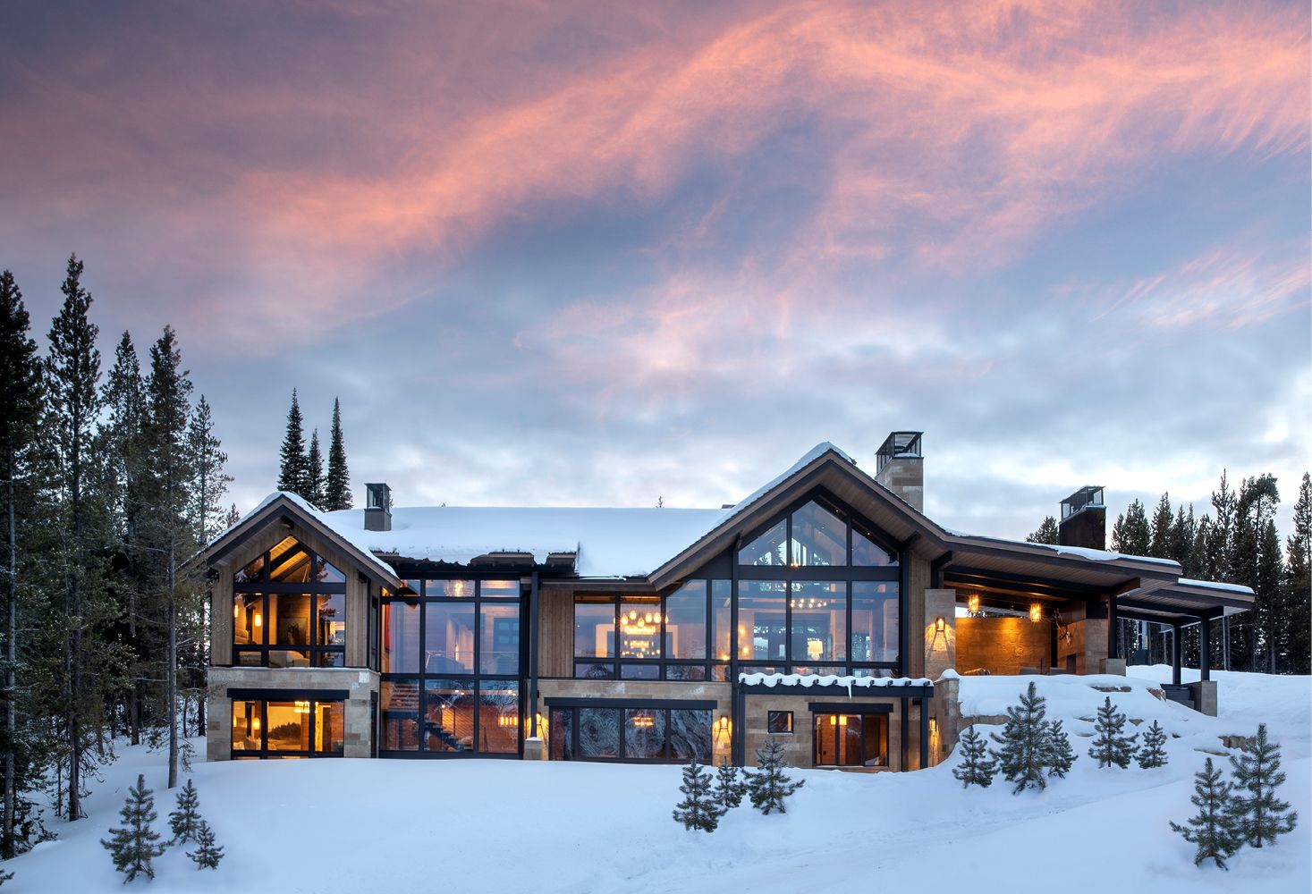 Exterior of rustic mountain home with roofline design with traditional gable trusses at both ends