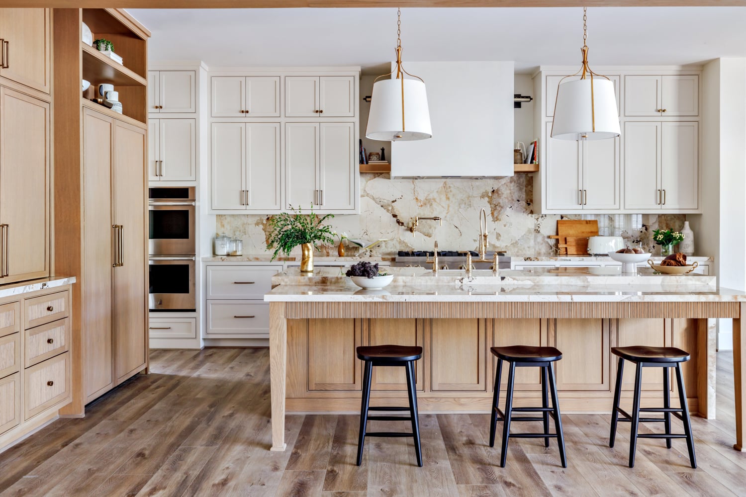 Modern farmhouse kitchen with white marble backsplash and countertops
