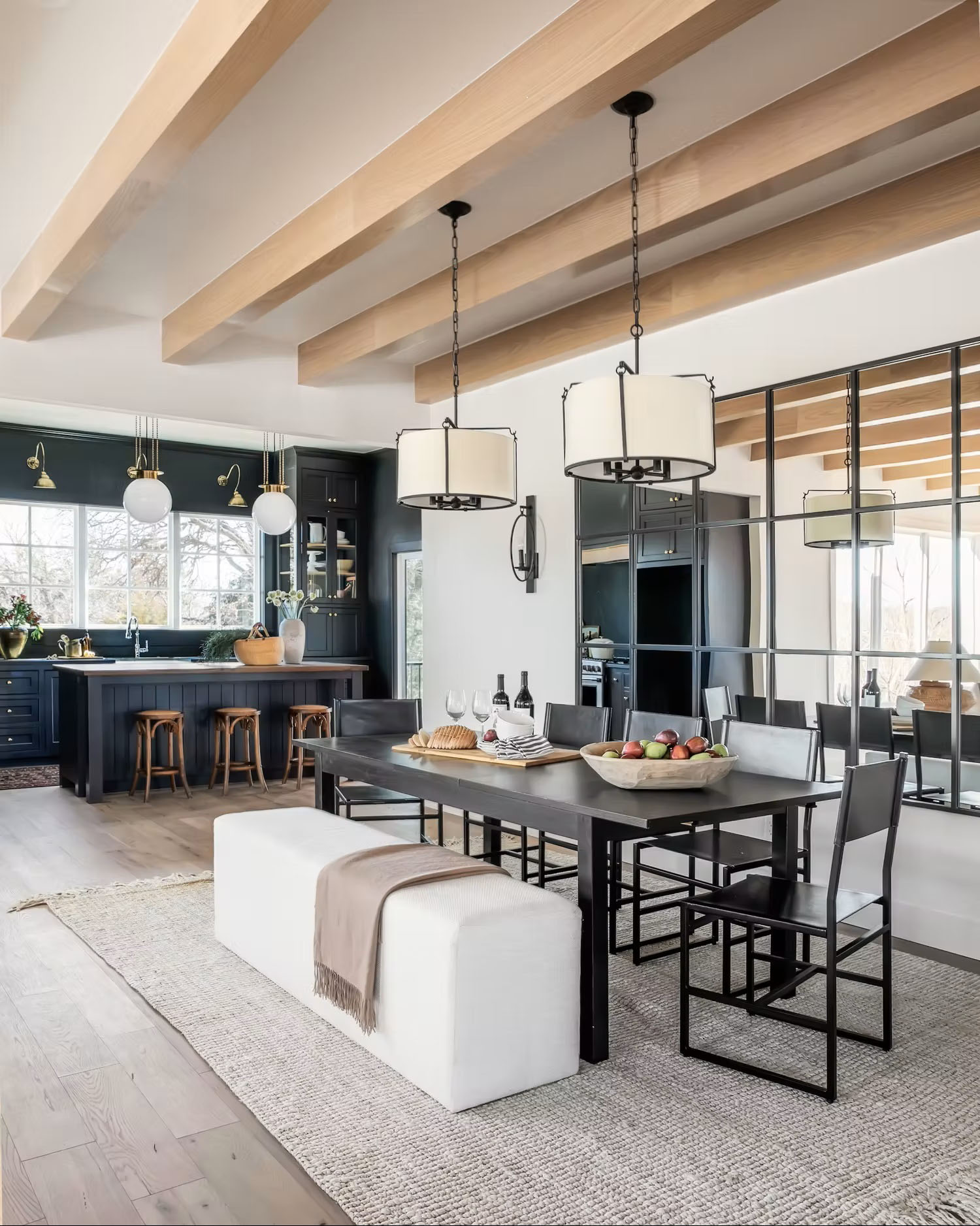 Open-concept kitchen with navy blue cabinets and white walls.