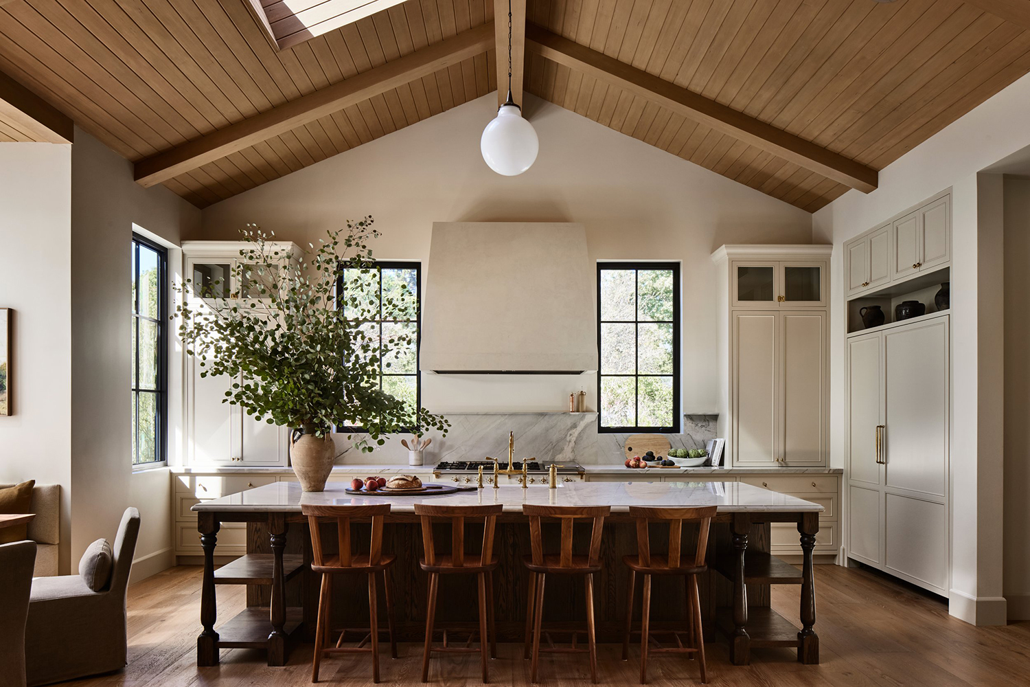 Modern Rustic Kitchen with Custom Cream Cabinetry & Wood Flooring