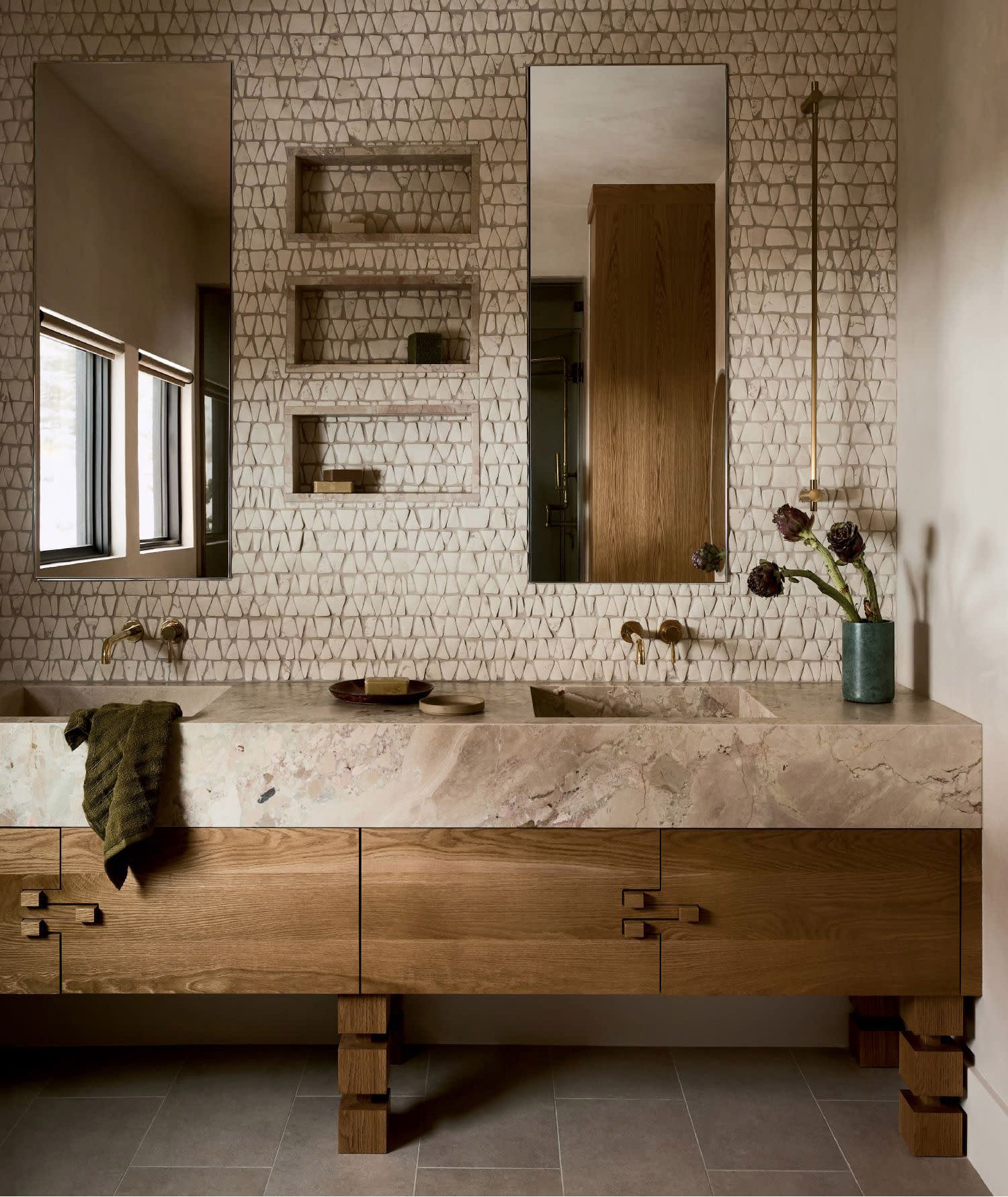 Modern farmhouse bathroom with thick slab marble countertop, wood vanity, and tile flooring.