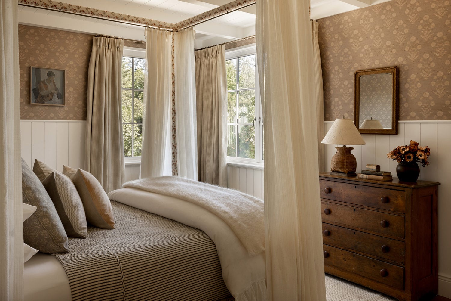 Modern farmhouse bedroom with cozy textures and layered bedding.