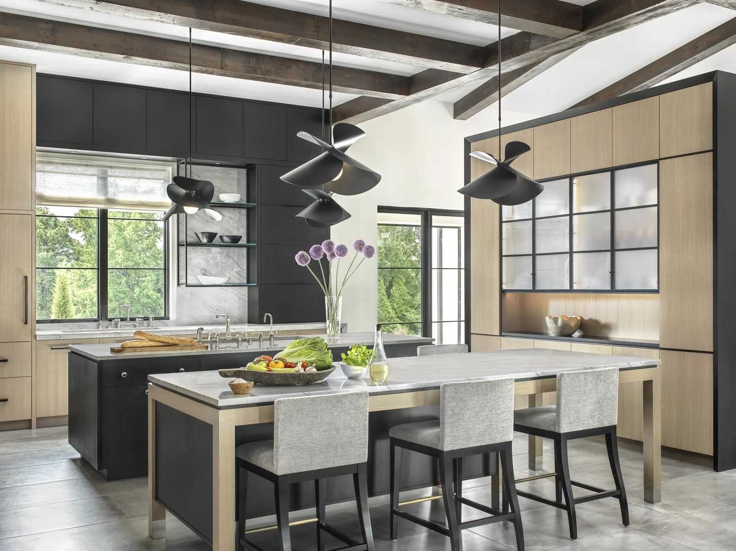 Contemporary kitchen combining light oak and black cabinets with two modern islands.