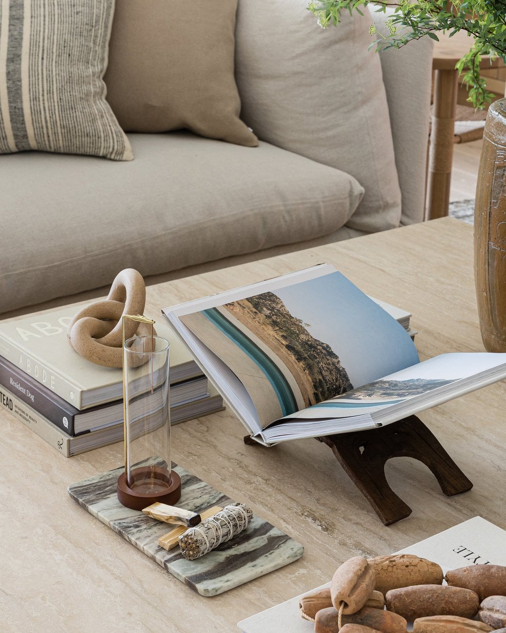 Coastal living room decorating tips: how to style open shelving and coffee tables.