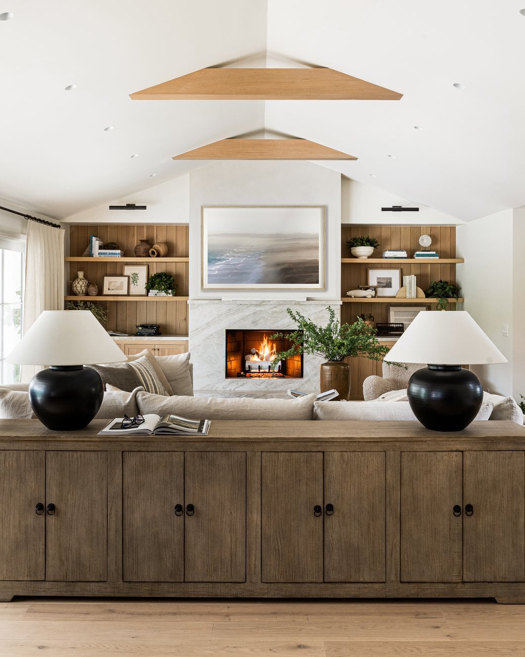 Coastal living room decorating tips: how to style open shelving and coffee tables.