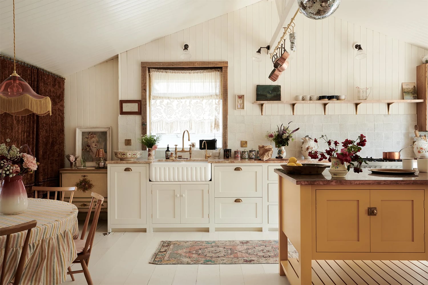 Country kitchen by deVol featuring Linen painted cupboards copper worktop handmade tile backsplash vintage area rug and antique decorative accents in East Sussex