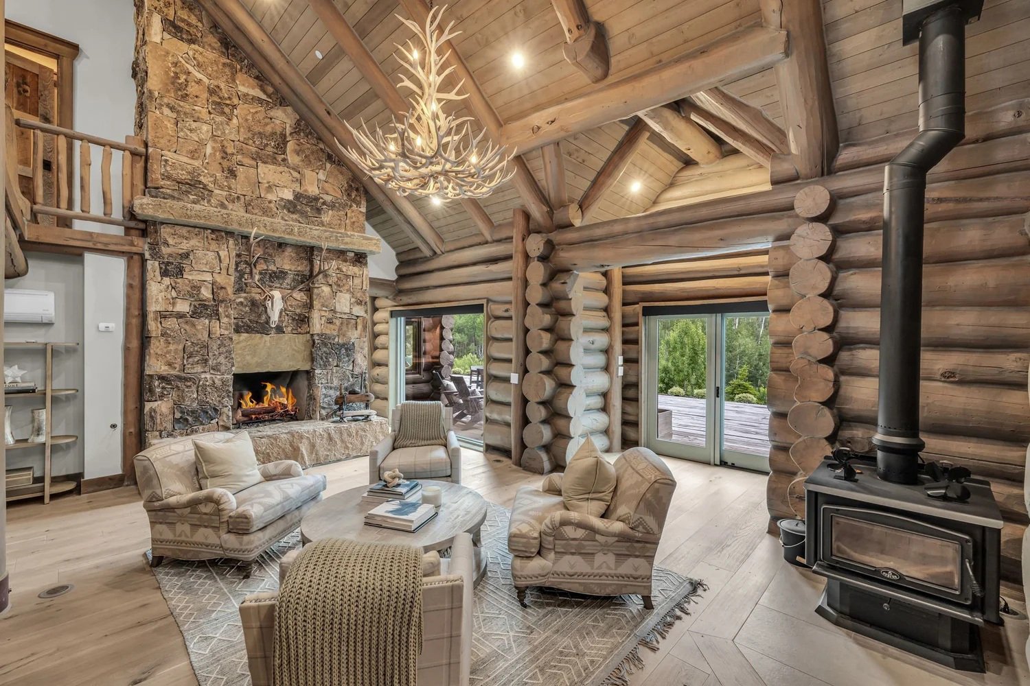 handcrafted-log-home-living-room Handcrafted Log Home Living Room with Stone Fireplace
