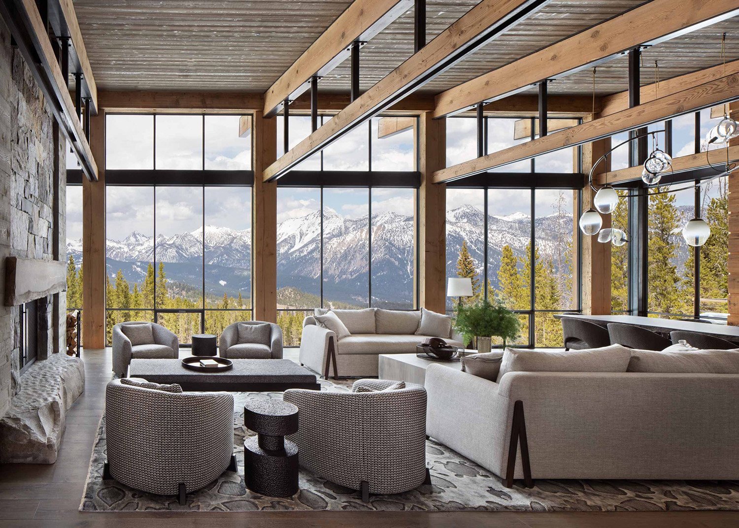 Modern Mountain Living Room with Stone Fireplace & Wood Beams