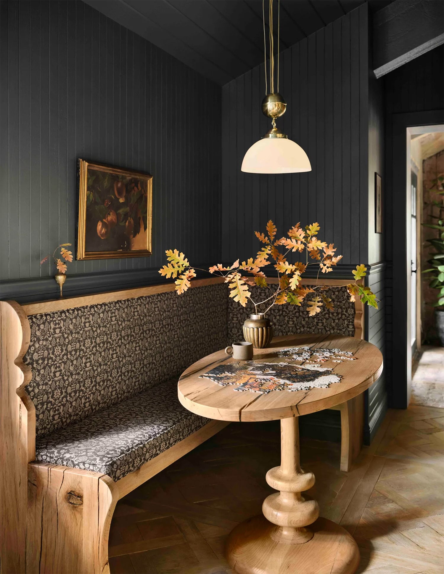 Galley-style kitchen converted into a library with tongue-and-groove paneling painted in Magnolia Home Ridge Rock.